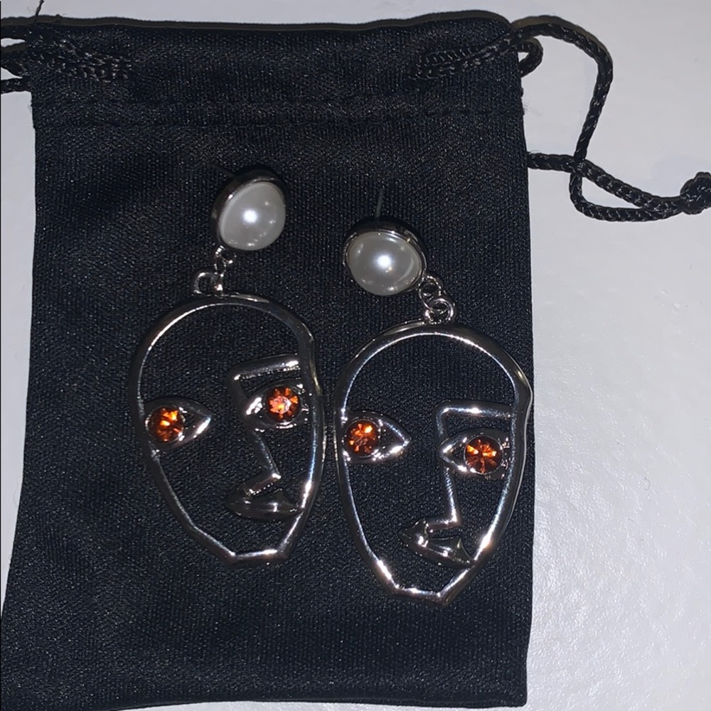 Never before worn silver face earrings